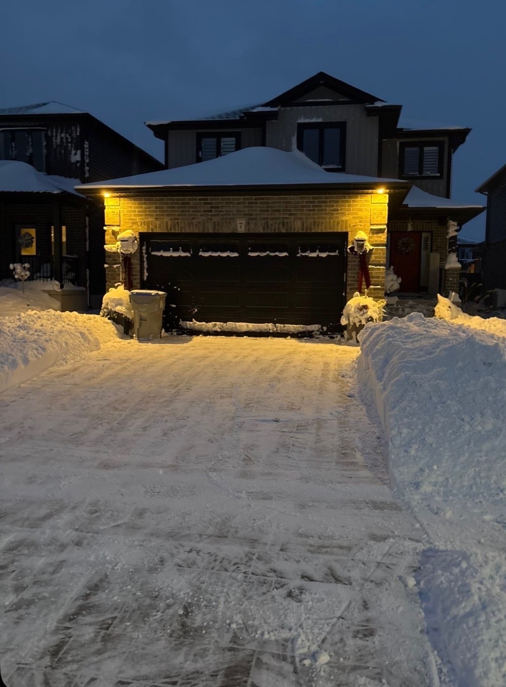 Residential driveway cleared after heavy snowfall